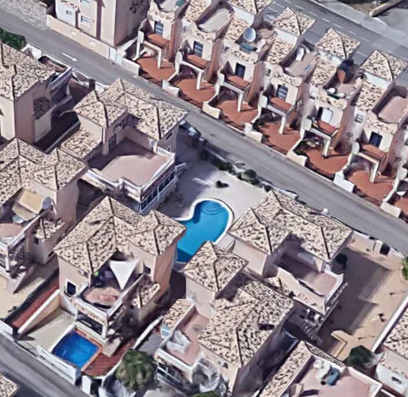 What are the consequences of having building work for extensions or pools carried out without a building licence in Spain?